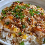 Grilled chicken and corn rice bowl with creamy sauce and lime.