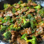 Close-up of a skillet filled with delicious beef and broccoli stir-fry.