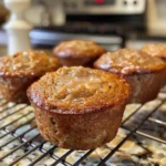 Close-up of several delicious cinnamon banana bread muffins sprinkled with sugar.